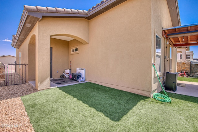 12826 Osmotherly Ave, El Paso, TX 79928 - rear view of property with stucco siding, a patio area, and a gate