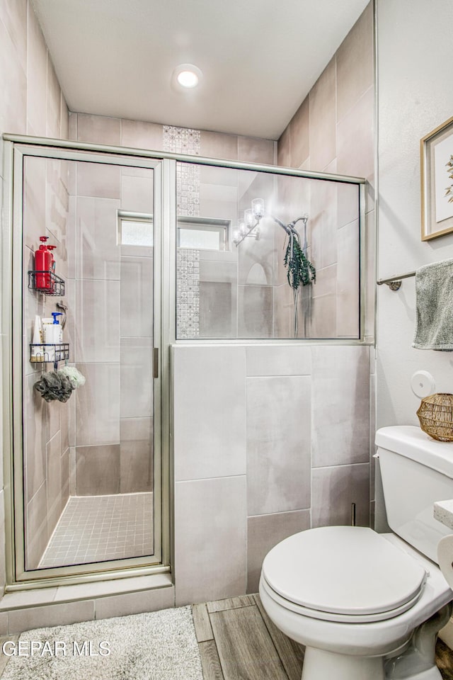 12826 Osmotherly Ave, El Paso, TX 79928 - bathroom with toilet, a shower stall, and recessed lighting