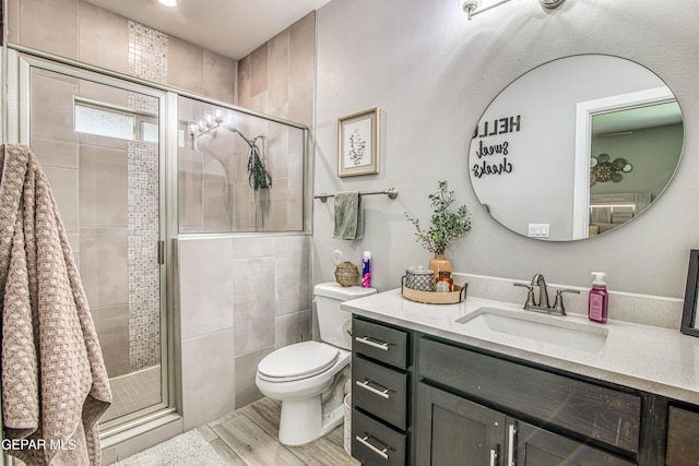 12826 Osmotherly Ave, El Paso, TX 79928 - bathroom with vanity, toilet, and a shower stall