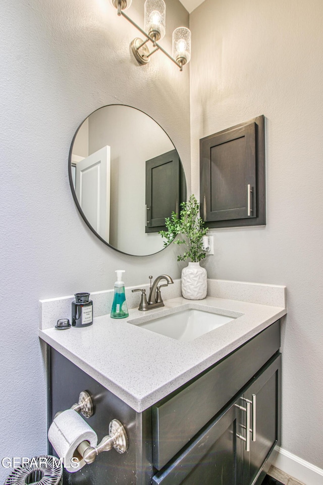 12826 Osmotherly Ave, El Paso, TX 79928 - bathroom with vanity and baseboards