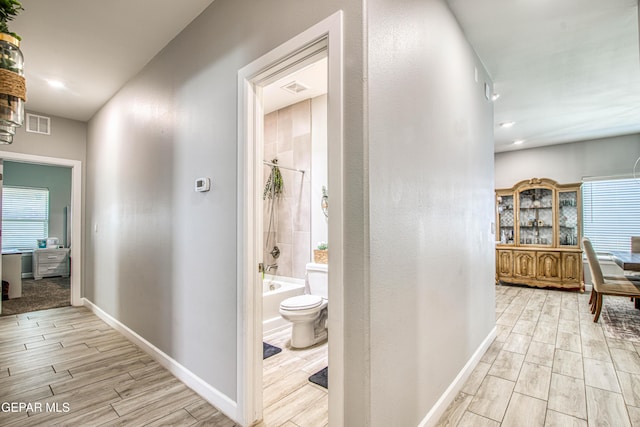 12826 Osmotherly Ave, El Paso, TX 79928 - hallway with light wood finished floors and baseboards