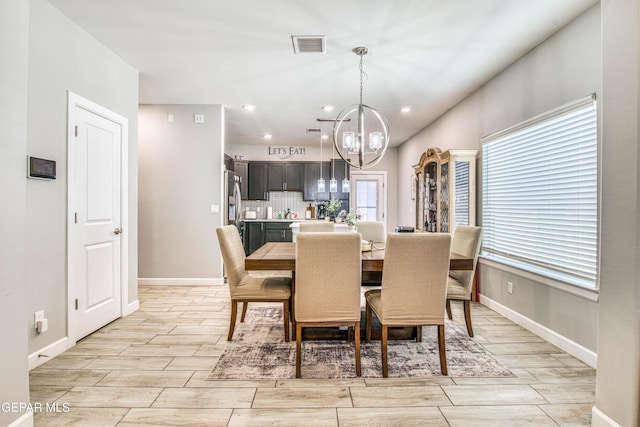 12826 Osmotherly Ave, El Paso, TX 79928 - dining room featuring a chandelier, wood finish floors, baseboards, and recessed lighting