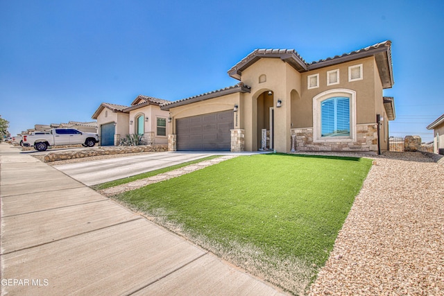 12826 Osmotherly Ave, El Paso, TX 79928 - mediterranean / spanish home featuring stone siding, stucco siding, driveway, and an attached garage