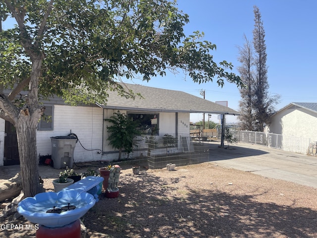 5608 Paraguay Ct, El Paso, TX 79903 - back of house featuring a shingled roof and driveway