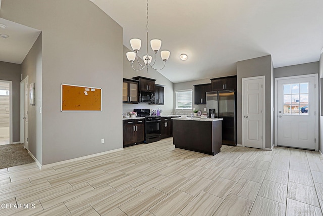 401 Gran Villa Pl, Socorro, TX 79927 - kitchen with black appliances, light countertops, a kitchen island, dark brown cabinets, and a chandelier