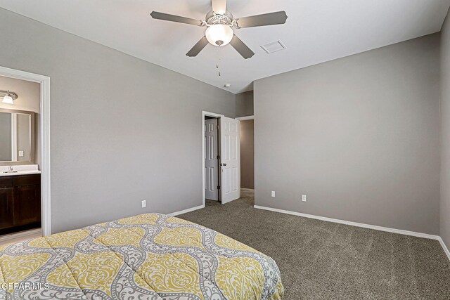 401 Gran Villa Pl, Socorro, TX 79927 - bedroom with light carpet, baseboards, ensuite bathroom, a sink, and a ceiling fan