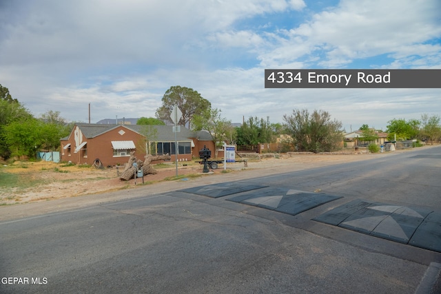 4334 Emory Rd, El Paso, TX 79922 - view of asphalt road with traffic signs