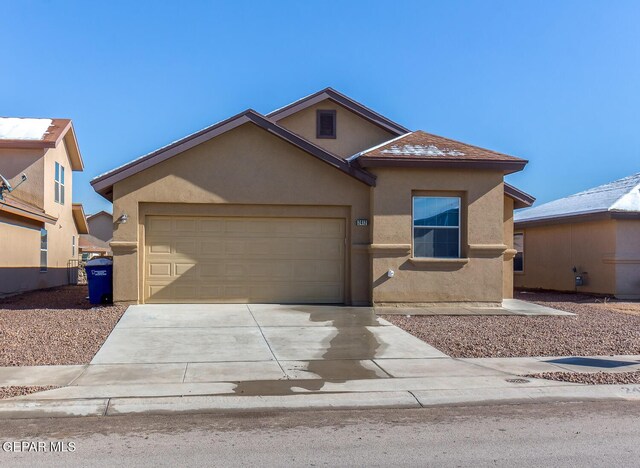 2412 Escape Point St, El Paso, TX 79938 - view of front of house featuring stucco siding, concrete driveway, and a garage