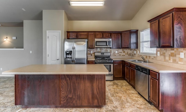2412 Escape Point St, El Paso, TX 79938 - kitchen with appliances with stainless steel finishes, a center island, a sink, backsplash, and light countertops