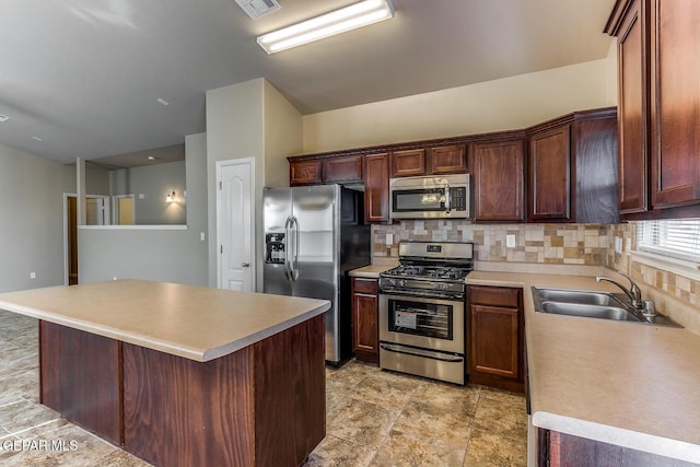 2412 Escape Point St, El Paso, TX 79938 - kitchen featuring appliances with stainless steel finishes, a sink, decorative backsplash, and light countertops