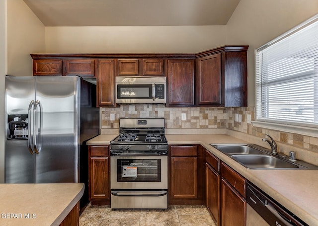 2412 Escape Point St, El Paso, TX 79938 - kitchen featuring stainless steel appliances, a sink, light countertops, and decorative backsplash