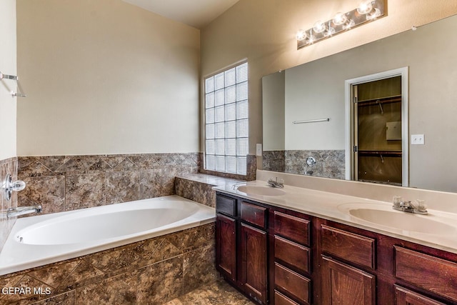 2412 Escape Point St, El Paso, TX 79938 - full bath featuring a bath, double vanity, and a spacious closet