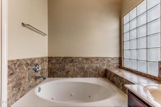 2412 Escape Point St, El Paso, TX 79938 - full bathroom with a tub with jets and vanity
