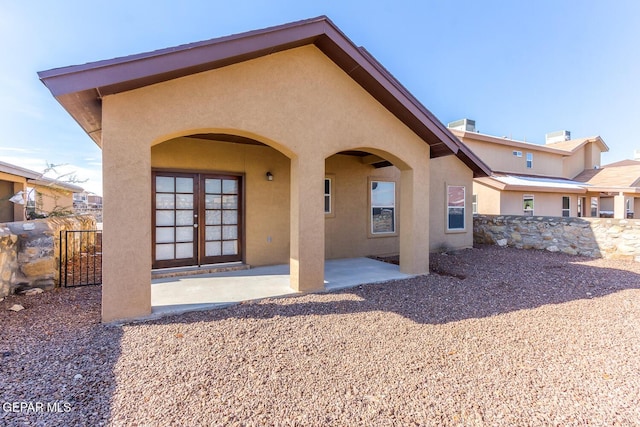 2412 Escape Point St, El Paso, TX 79938 - rear view of house with stucco siding and a patio area