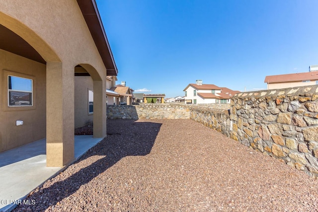 2412 Escape Point St, El Paso, TX 79938 - fenced backyard with a patio area
