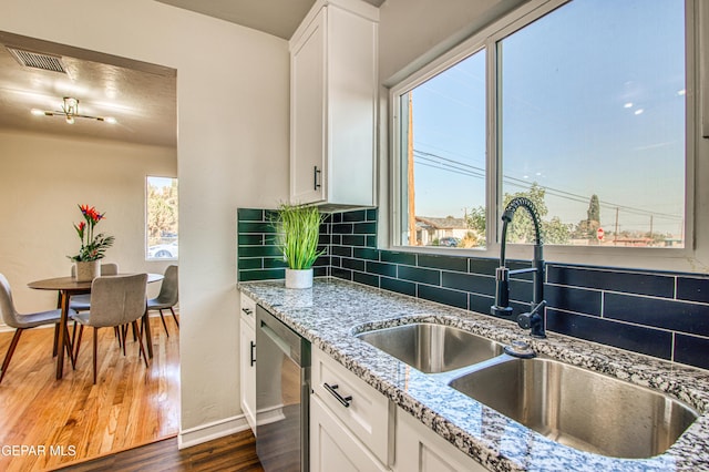 1401 N Boone St, El Paso, TX 79903 - kitchen with dishwasher, healthy amount of natural light, and a sink