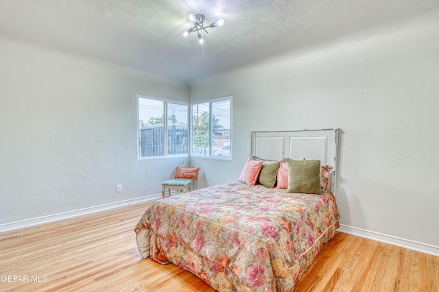 1401 N Boone St, El Paso, TX 79903 - bedroom featuring wood finished floors and baseboards