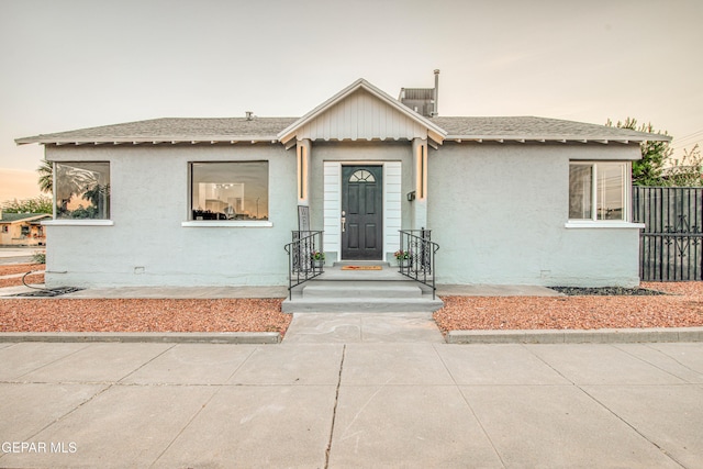 1401 N Boone St, El Paso, TX 79903 - view of front of property with stucco siding and roof with shingles