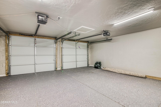 1401 N Boone St, El Paso, TX 79903 - garage with a garage door opener and baseboards