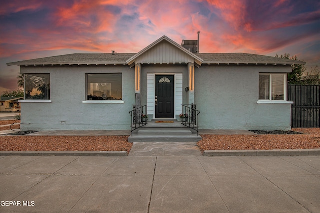 1401 N Boone St, El Paso, TX 79903 - view of front facade with stucco siding, roof with shingles, and central AC unit
