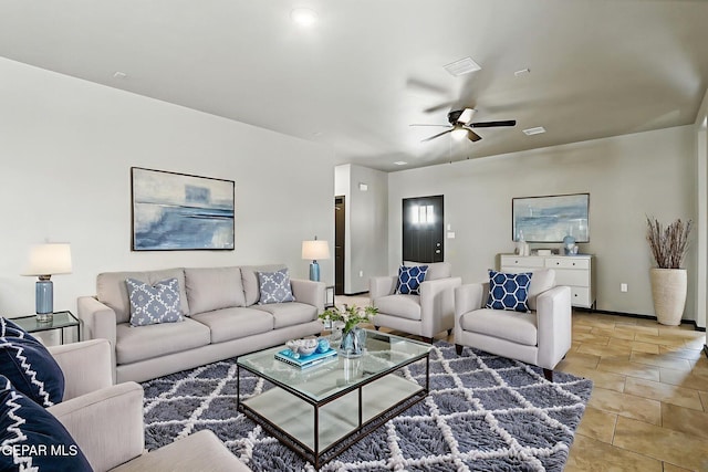 14425 Donny Murray Ln, Horizon City, TX 79928 - living room featuring a ceiling fan, baseboards, and light tile patterned floors