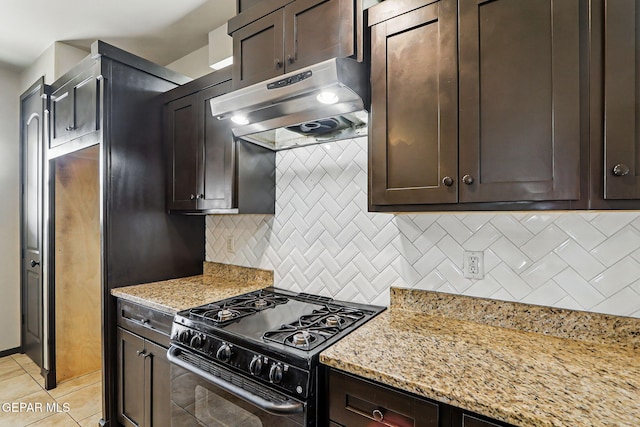 14425 Donny Murray Ln, Horizon City, TX 79928 - kitchen with black gas range, under cabinet range hood, tasteful backsplash, and dark brown cabinetry