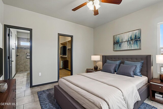 14425 Donny Murray Ln, Horizon City, TX 79928 - bedroom with light tile patterned floors, a walk in closet, a closet, ensuite bathroom, and a ceiling fan