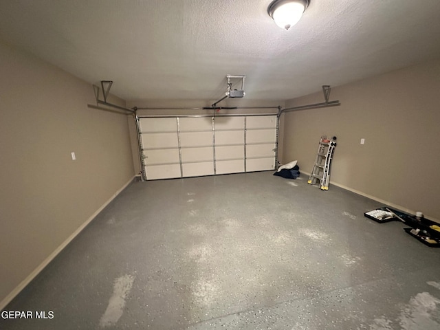 7217 Long Meadow Dr, El Paso, TX 79934 - garage with a garage door opener and baseboards