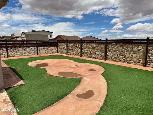 7217 Long Meadow Dr, El Paso, TX 79934 - fenced backyard with a putting area