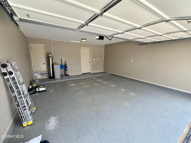7217 Long Meadow Dr, El Paso, TX 79934 - garage featuring baseboards and a garage door opener