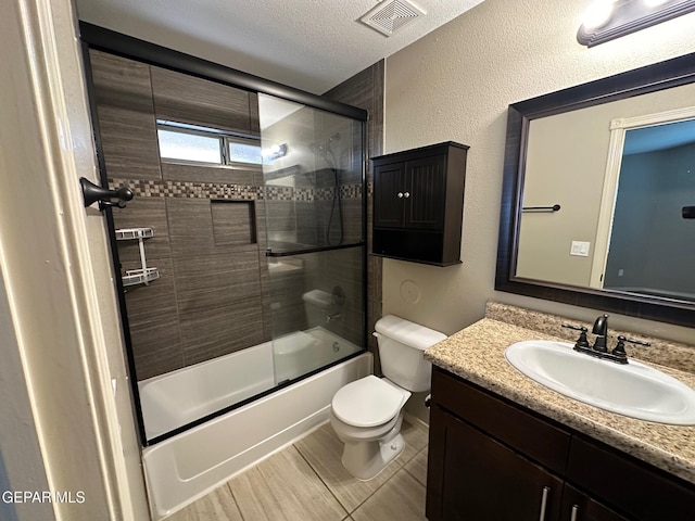 7217 Long Meadow Dr, El Paso, TX 79934 - full bathroom featuring vanity, toilet, shower / bath combination with glass door, and baseboards