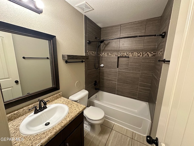 7217 Long Meadow Dr, El Paso, TX 79934 - full bathroom featuring vanity, toilet, a textured ceiling, and bathing tub / shower combination