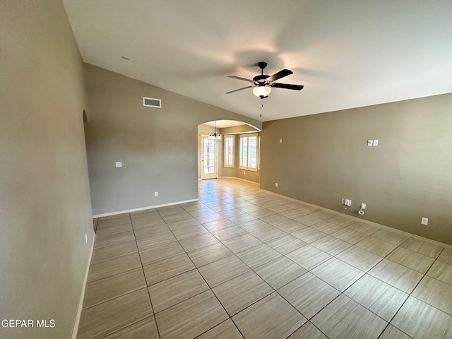 7217 Long Meadow Dr, El Paso, TX 79934 - unfurnished room with ceiling fan, arched walkways, light tile patterned flooring, vaulted ceiling, and baseboards