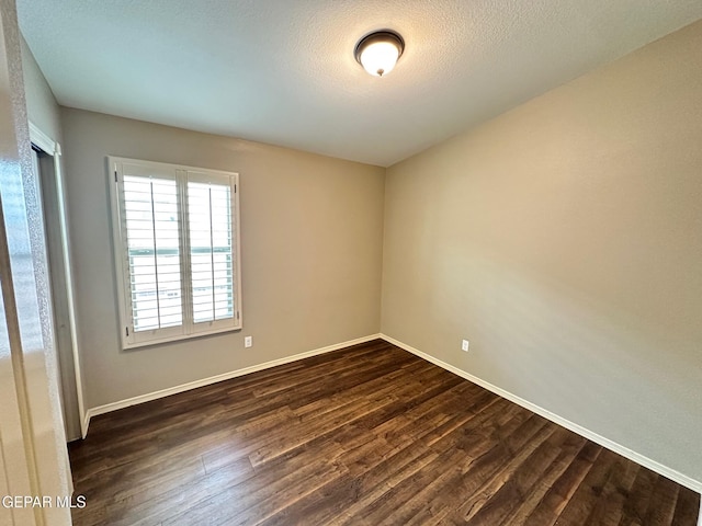 7217 Long Meadow Dr, El Paso, TX 79934 - unfurnished room featuring dark wood finished floors and baseboards