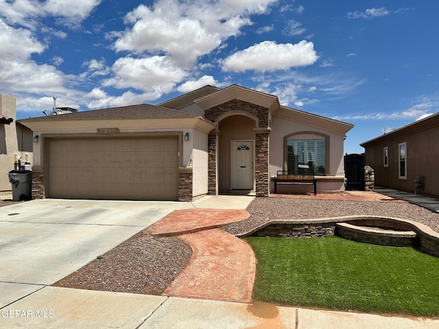 7217 Long Meadow Dr, El Paso, TX 79934 - view of front of home with stucco siding, stone siding, a garage, driveway, and a front lawn