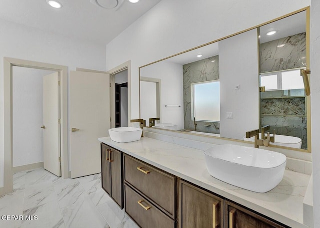 12748 Polo Norte Dr, El Paso, TX 79934 - full bath featuring double vanity, healthy amount of natural light, recessed lighting, marble finish floors, and a marble finish shower