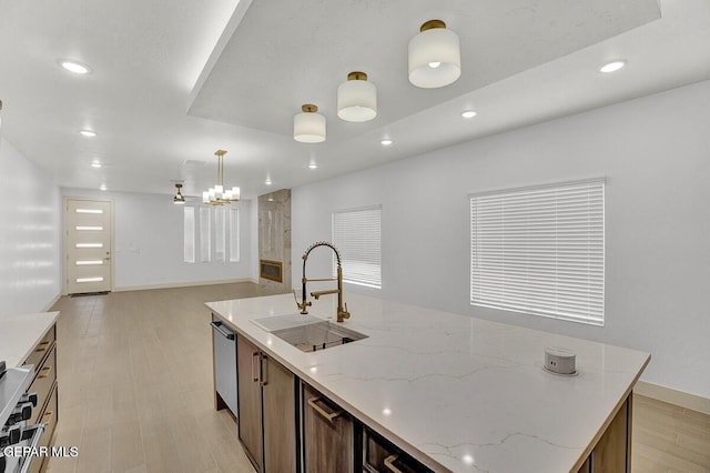 12748 Polo Norte Dr, El Paso, TX 79934 - kitchen with recessed lighting, open floor plan, light wood-type flooring, appliances with stainless steel finishes, and decorative light fixtures