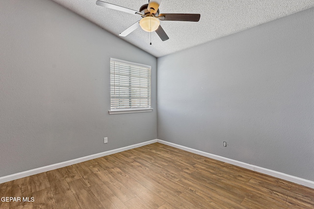 11912 Mesquite Miel Dr, El Paso, TX 79938 - unfurnished room featuring wood finished floors, a ceiling fan, a textured ceiling, baseboards, and lofted ceiling