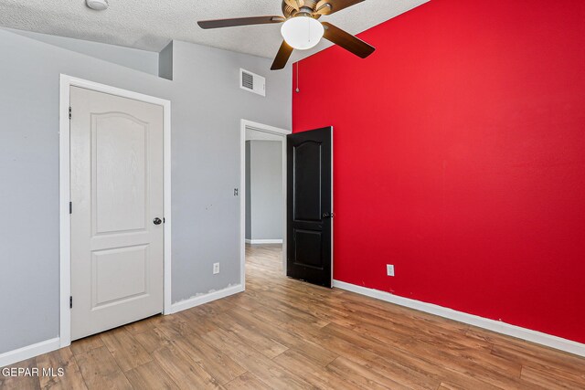 11912 Mesquite Miel Dr, El Paso, TX 79938 - unfurnished bedroom featuring wood finished floors, baseboards, a textured ceiling, and a ceiling fan