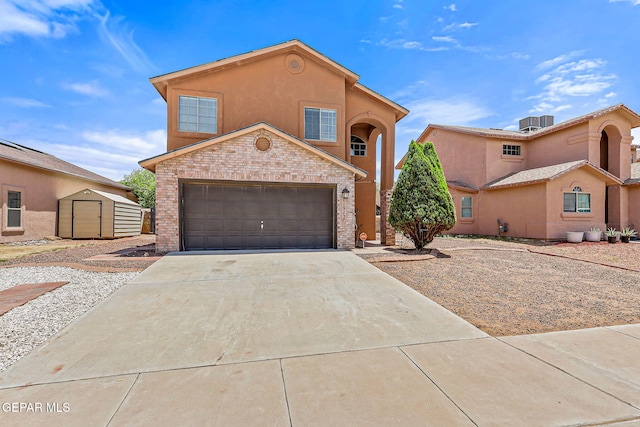11912 Mesquite Miel Dr, El Paso, TX 79938 - view of front of house featuring concrete driveway, brick siding, a garage, and stucco siding