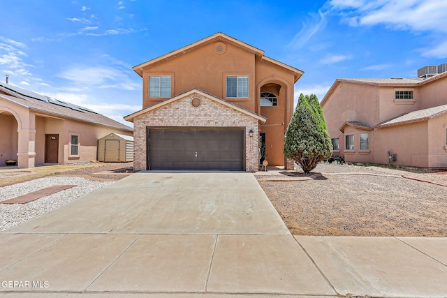 11912 Mesquite Miel Dr, El Paso, TX 79938 - view of front of house featuring driveway, brick siding, and stucco siding