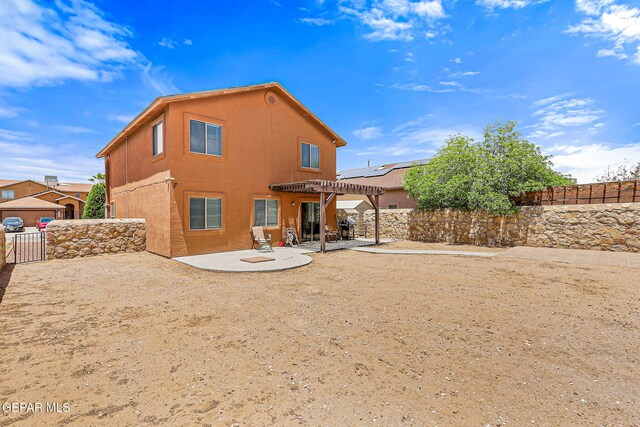 11912 Mesquite Miel Dr, El Paso, TX 79938 - rear view of house featuring a patio, a pergola, a fenced backyard, a gate, and stucco siding