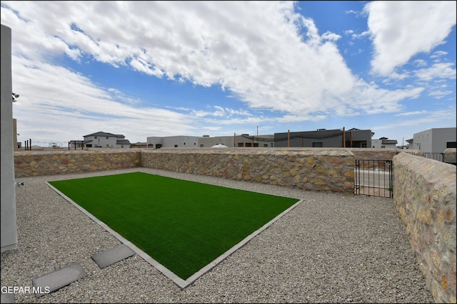 13106 Cleethorpes St, El Paso, TX 79928 - view of yard with a gate and a residential view