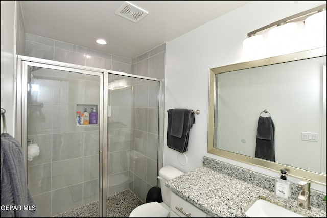 13106 Cleethorpes St, El Paso, TX 79928 - bathroom featuring vanity, a shower stall, toilet, and recessed lighting