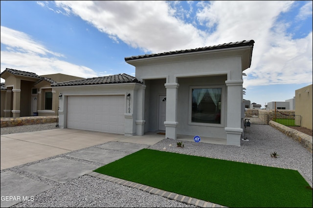 13106 Cleethorpes St, El Paso, TX 79928 - view of front of property with a tiled roof, concrete driveway, an attached garage, and stucco siding