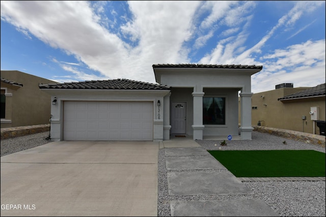 13106 Cleethorpes St, El Paso, TX 79928 - view of front of property featuring concrete driveway, a garage, a tile roof, and stucco siding