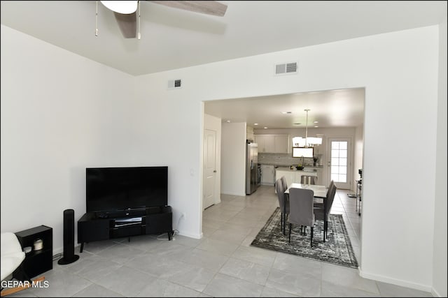 13106 Cleethorpes St, El Paso, TX 79928 - dining area featuring baseboards, a ceiling fan, and a chandelier