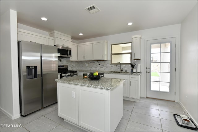 13106 Cleethorpes St, El Paso, TX 79928 - kitchen with appliances with stainless steel finishes, a sink, light tile patterned flooring, tasteful backsplash, and recessed lighting