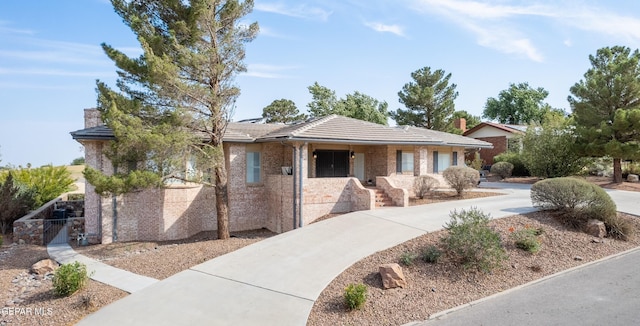 1013 Singing Hills Dr, El Paso, TX 79912 - ranch-style home featuring a tiled roof and brick siding