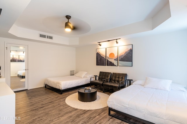 1013 Singing Hills Dr, El Paso, TX 79912 - bedroom with a tray ceiling, wood finished floors, baseboards, and ceiling fan